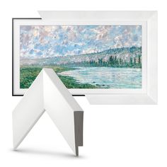 a painting is hanging on the wall next to it's white frame and base