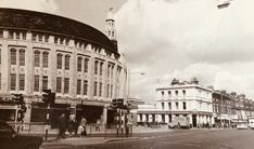 an old black and white photo of a city street