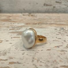 Ring with 18 Kt yellow gold plated silver and White baroque freshwater Pearl. Pearl: 2x1,7 cm The band measures 0,5 cm. Italian size 13 US size: 6,5 If you want another dimension you can contact me. As all my jewels, the ring is designed and handmade with love at my art lab in Umbria the heart of Italy. The ring is stamped with the mark 925. The ring will be sent to you in a beautiful gift box with a certificate of warranty. FREE SHIPPING  For Payment and Shipping Please read Shop Polices. Your item will be shipped via registered mail with tracking number. I ship all of my packages First Class or Priority Mail with tracking and insurance. Check out CHIARABATELIER on Instagram: chiara.b_prezioselaborazioni for new work previews, news and info on upcoming sales Gold Pearl Charm Open Ring, Classic Gold Pearl Ring With Pearl Charm, Classic Gold Pearl Drop Ring, Classic Gold Pearl Ring With Pearl Drop, Gold Ring With Pearl Drop, Gold Pearl Drop Ring, Gold Rings With Pearl Drop, Classic Yellow Gold Plated Pearl Ring, Gold Round Pearl Charm Ring