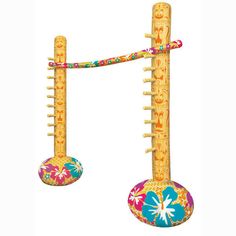 two wooden poles with colorful designs on them and one pole is holding a ball in the air