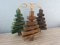 three wooden toys stacked on top of each other