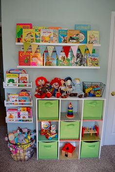 a book shelf filled with lots of books and toys