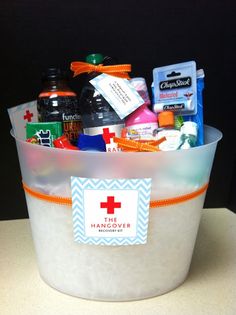 a white bucket filled with lots of different types of medical care items on top of a table