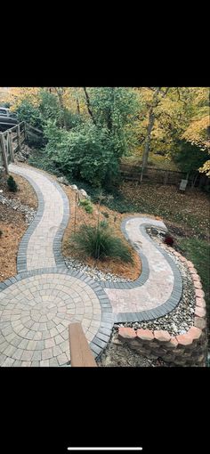 a stone path in the middle of a garden