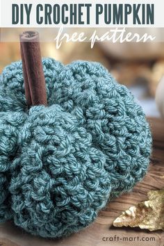 a crocheted pumpkin sitting on top of a wooden table with text overlay