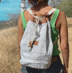 "The Nautical beach bag was designed to be used as a backpack in any occasion. This beautifully designed bag has a main compartment with a small interior pocket and an external zippered hidden pocket very useful to access keys, wallet or cellphone.  It has also a leather top closure with adjustable  straps.   This stylish sailor bag is a lightweight backpack perfect to carry your belongings anywhere you go! Length 10\" x Height 17\" Width 9\"/ 25 cm x 43 cm x 23 cm Overview: Handmade in Argentina Materials: Full grain leather and cotton canvas For summer and stylish beach tote bags visit: https://www.etsy.com/listing/505674980/navy-stripes-beach-tote-in-cotton-canvas?ref=shop_home_active_3 For Stylish and unique bicycle bags visit my other shop Bicibybar: https://www.etsy.com/shop/BiciByBa Casual White Beach Bag With Canvas Lining, White Backpack For Beach, White Backpack For The Beach, Summer Backpack With Adjustable Strap In White, White Coastal Bags For Everyday Use, Summer White Backpack With Adjustable Strap, White Summer Backpack With Adjustable Strap, White Nautical Bags For Summer, Casual Beach Backpack With Adjustable Strap