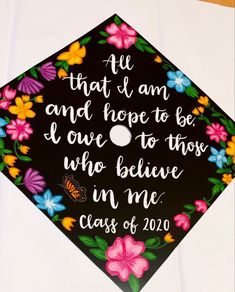 a graduation cap decorated with flowers and the words, he that i am and hope to be love to those who believe in me class of 2010