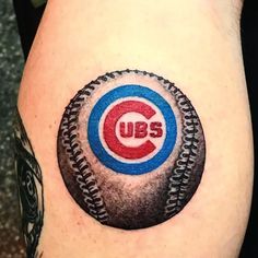 a baseball tattoo with the chicago cubs on it