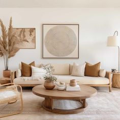 a living room filled with lots of furniture and decor on top of carpeted flooring