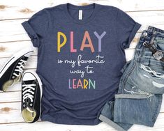 Pediatric Speech Therapy Play is my favorite way to learn Shirt - Unisex T Shirt, Women Racerback Tank, Long Sleeve T-Shirt Tees Tshirt Sweatshirt Sweater Hoodie Gift For Men Women Boys Girls Play is my favorite | Speech Therapy | Pediatric SLP | Speech Language | Kids speech | Rainbow SLP Shirt | Speech Therapist Tee | SLP Therapist | cute SLP Shirt | Occupational shirt | gift for Therapist | Occupational Therapy | OT graduation gift Well, let's say goodbye to all this boring apparel... The God Pediatric Speech Therapy, Physical Therapy Shirts, Shirt Slogans, Play Therapist, Occupational Therapy Shirts, Speech Therapy Shirts, Slp Shirts, Pediatric Physical Therapy, Maker Ideas