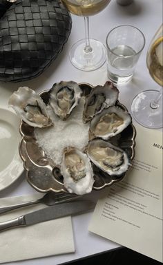 oysters on the half shell with salt and wine glasses