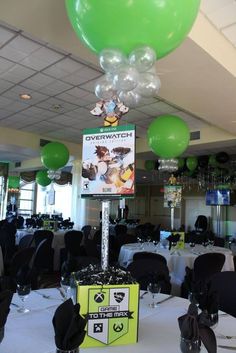 balloons are floating over the tables at an event