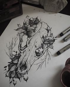 a drawing of a skull with flowers on it