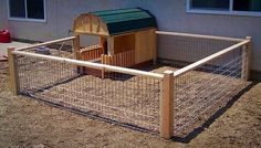 a chicken coop in front of a house