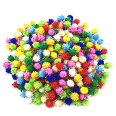 multicolored pom poms are arranged in a circle on a white background