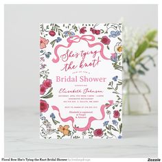 the floral bridal shower is displayed on a table