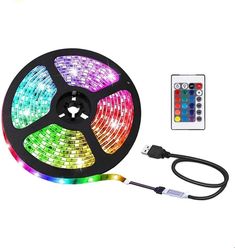 the multicolored led strip light is next to a remote control