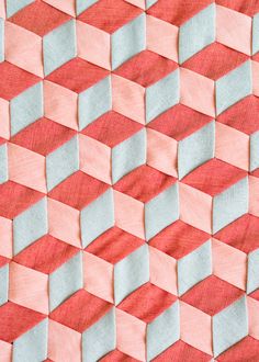 an orange and pink background with small squares