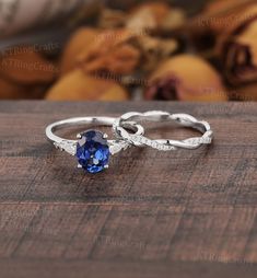 "MADE TO ORDER * Material: Solid gold(14K/18K white/yellow/rose gold) * DETAILS  Engagement ring - center stone: Lab sapphire 6*8mm oval cut - width: approximately 1.5mm - thickness: approximately 1.3mm Side stone: Moissanite or Diamond - diamond:0.16ct,2*3mm pear cut, Color G-H, Clarity SI-VS - moissanite:0.16ct Wedding band Stone: Moissanite or diamond - diamond:0.17ct,Color G-H, Clarity SI-VS - moissanite:0.17ct Width: approximately 2.7mm Thickness: approximately 1.4mm * Click on the \"Pin It\" icon if you like this item * Custom Order We can make custom rings in almost any shape and style. If you want a specific model, please send us a clear picture and we will do our best.  * Shipping Most items take 3-4 weeks to create.I'm happy to rush your order, fees may apply, write me for detail Blue Sapphire Engagement Ring Silver, Non Traditional Unique Engagement Rings Vintage Blue Sapphire, Saphire Engament Ring Set Silver, Sparkly Rings, Sapphire Wedding Ring Set, Sapphire Antique Ring, White Gold Sapphire Ring, Sapphire Engagement Ring Set, Blue Sapphire Engagement Ring