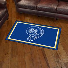 3' x 5' Los Angeles Rams Retro Logo Blue Rectangle Area Rug. Show off your team pride in a big way! 3'x5' ultra plush area rugs won't leave any doubt about who you will be rooting for on game day! Non-skid backing keeps rug in place. Made of 32 ounce nylon carpet, which feels great on your feet. Chromojet printed in vibrant true team colors. Cleaning is a breeze, just vacuum regularly. Great for g Nylon Carpet, Plush Area Rugs, Game Rooms, Kids Gear, Man Caves, Plush Rug, Backyard Party, Retro Logo, Los Angeles Rams