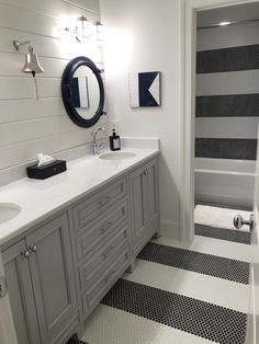 a bathroom with black and white checkered flooring