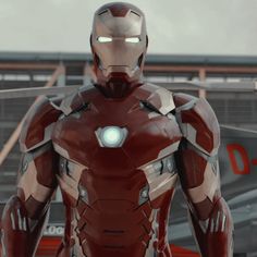 an iron man standing in front of a building with his hands on his hips and glowing eyes