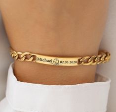 Introducing our Personalized 18K Gold Plated Bracelet - the perfect unisex accessory that captures the essence of life's most precious moments. Whether you're commemorating the birth of a child or celebrating a cherished anniversary, this bracelet is designed to be both meaningful and stylish. The custom engraving of a name, a significant date, and a charming baby symbol makes this piece a unique and sentimental treasure. Crafted with precision, this bracelet features a premium 18K gold plating Gold Bracelet With Name, Nameplate Bracelet, Meaningful Jewelry, Jewelry Studio, Unisex Bracelets, Gold Plated Bracelets, Baby Gif, Unisex Accessories, Precious Moments