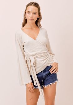 This bohemian chic long bell sleeve wrap-around top is so soft & flattering, you’ll never want to take it off. With... Knit Wrap Top, Taupe Sweater, Wrap Front Top, Winter Outfits Aesthetic, Neutral Sweaters, Stitch Clothes, Take It Off, Boho Skirt, Cropped Cardigan Sweater