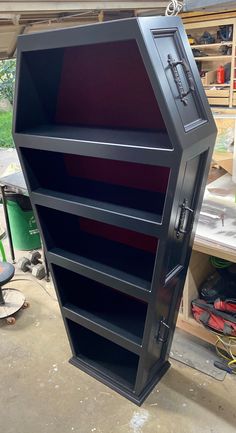 a large metal storage cabinet sitting inside of a garage