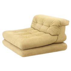 a beige reclining chair sitting on top of a white floor