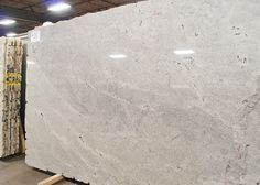 a large white marble slab in a warehouse