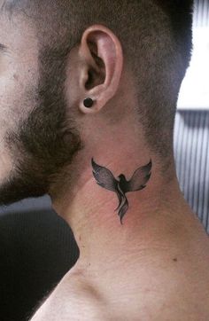 a man with a bird tattoo on his neck