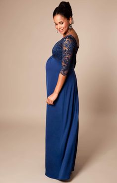 Make an entrance with our Lucia Maternity Gown in stunning Imperial Blue. Designed to fit and flatter at every stage of pregnancy, there’s elegant gathering under the bust to define your waist and a luxurious floor-length skirt with a subtle sheen to skim over your curves. Featuring a sheer lace bodice with mid-length sleeves and a sultry v-shaped back for added drama, you’ll turn heads at every special occasion. Sheer lace neckline V-Shaped Back ¾ length sleeves Jersey skirt with a subtle sheen Elegant Maxi Maternity Gown, Elegant Maternity Maxi Dress, Elegant Maternity Maxi Gown, Blue Maxi Maternity Dress For Wedding, Blue Maxi Maternity Dress For Party, Blue Maxi Length Maternity Dress For Wedding, Elegant Maternity Maxi Dress With Empire Waist, Elegant Floor-length Maxi Dress For Maternity, Elegant Maternity Gown With V-neck