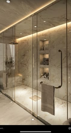 an elegant bathroom with marble walls and flooring