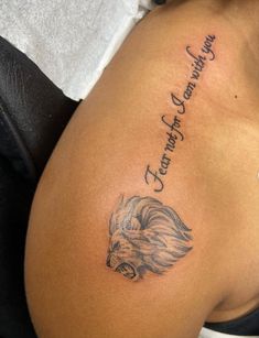 a woman with a lion tattoo on her stomach and the words, strength is always strong