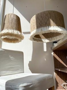 two lamps hanging from the ceiling in a room