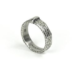 a silver ring on a white background