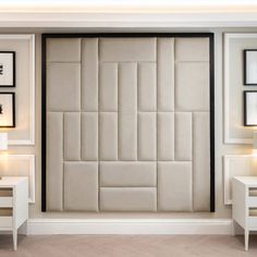 a room with white furniture and pictures on the wall, including a bed headboard