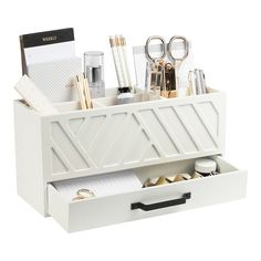 a white desk organizer with drawers and office supplies