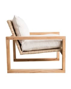 a wooden chair with a white pillow on it's back and seat cushion in the middle