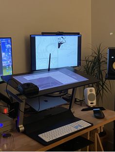 there are three computer monitors on the desk