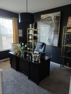 Home office painted in black, decorated with gold shelves, and gold accents. Gold White Black Office, Male Desk Decor Office Ideas, Black Decor Office, Black White Gold Teal Office Decor, His Office Decor, Black Walls Office Design, Masculine Glam Office, Boujee Home Office, Professional Home Office Ideas