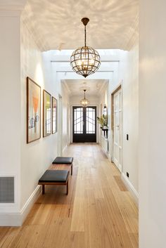 the hallway is clean and ready for us to use as an entrance way in this home