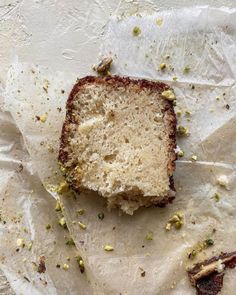 a piece of cake sitting on top of white paper