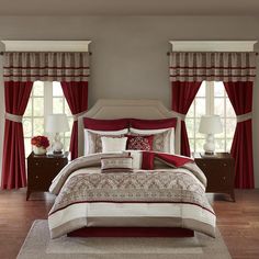 a bed room with a neatly made bed and red curtains