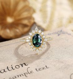 Oval Blue Green Sapphire Engagement Ring, Vintage Teal Sapphire Ring, Halo Moissanite Ring, Half Eternity Moissanite Band Ring#:NC1118 Center stone: Teal sapphire(Blue Green Sapphire) oval cut 5*7mm side stones: moissanite or diamond size/weight:0.55ct,1.5*3mm marquise/round Custom orders are most welcome! Please feel free to ask for any item, any adjustments or anything else you want me to make. Rush order Orders can be expedited for a fee. If your order needs to be expedited, please contact us Teal Sapphire Engagement Rings, Moissanite Halo Ring With Gemstone, Moissanite Gemstone Cluster Ring With Round Cut, Sapphire Moissanite Diamond Ring With Halo Setting, Oval Sapphire Ring With Halo Setting In Moissanite, Moissanite Gemstone Cluster Ring In White Gold, Emerald Moissanite Ring With Halo Design For Gift, Moissanite Emerald Ring With Halo Design For Gift, Oval Sapphire Ring With Moissanite Halo Setting