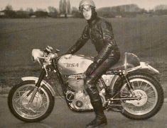 black and white photograph of a man on a motorcycle