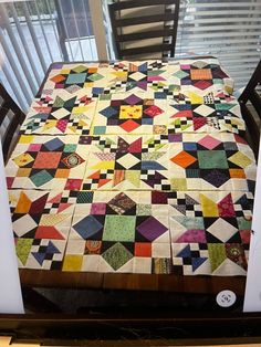 a table that has a quilt on it