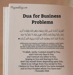 an open book with arabic writing on the front and back cover, which reads dua for business problems