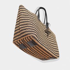 The ultimate in beachside luxury with the Bianca Tote, crafted for your stylish escapes to Capri, st. Tropez, and other exciting destinations.Be the trendsetter with this must-have tote. Raphia crochet Nappa soft calfskin Top handle, 9.5'' (24,1 cm) drop Height: 13'' (33cm) Width: 17,7'' (45cm) Depth: 9,8'' (25cm) Gold hardware Detachable raphia crochet & leather pouch (Height: 8'' (20cm) Width: 10.7'' (27cm)) Canvas lining 100% Made in Italy. Cleaning and Care Our handbags are made of the highe Luxury Summer Straw Bag With Open Weave, Luxury Jute Straw Bag With Braided Handles, Chic Beach Bag With Rolled Handles For Travel, Luxury Woven Jute Straw Bag, Luxury Natural Straw Bag For Beach, Luxury Natural Straw Beach Bag, Luxury Open Weave Straw Bag For Summer, Luxury Basket Straw Bag For Vacation, Luxury Natural Woven Crochet Bag